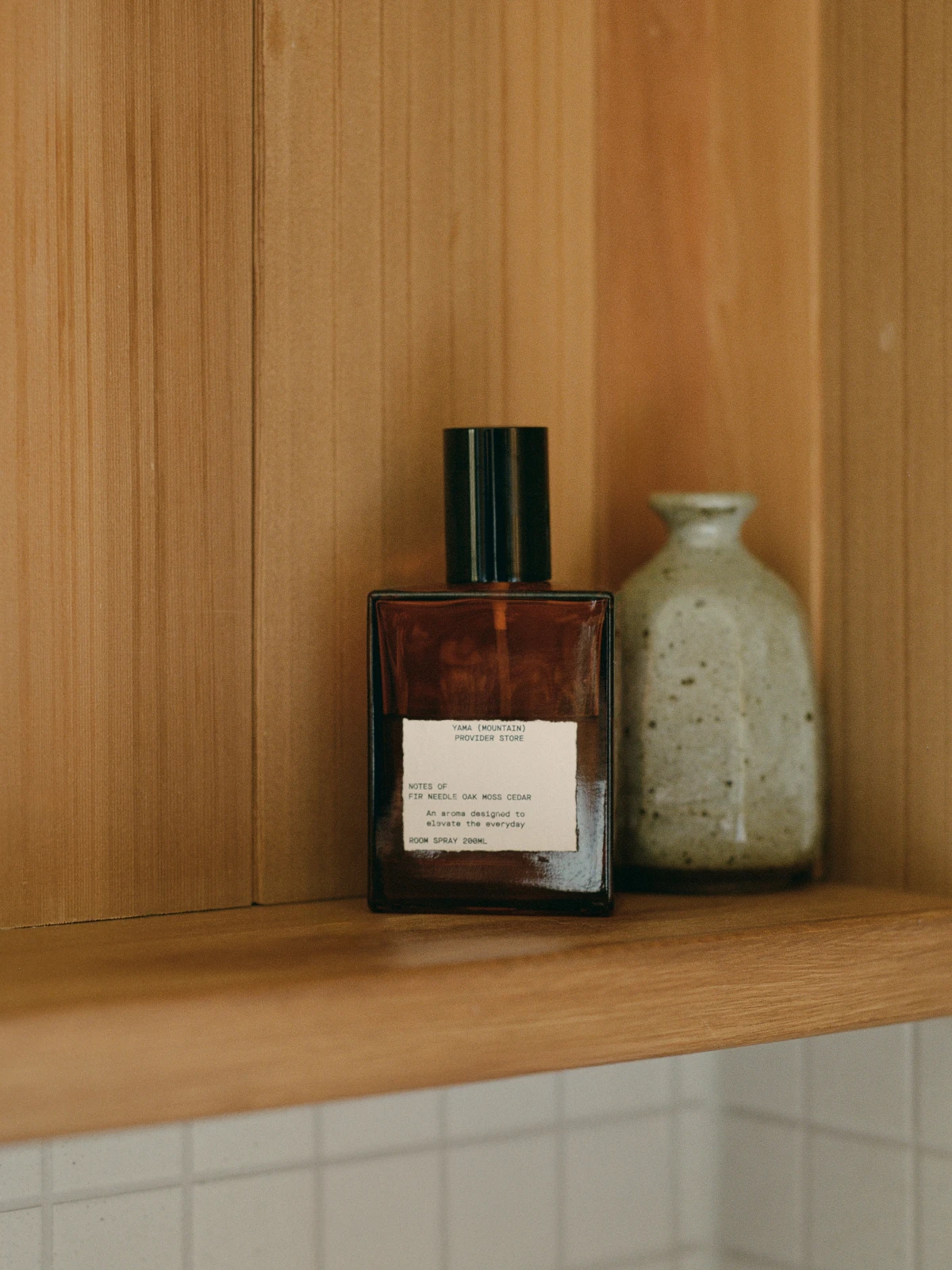 A Provider Store soap bottle styled in warm light.
